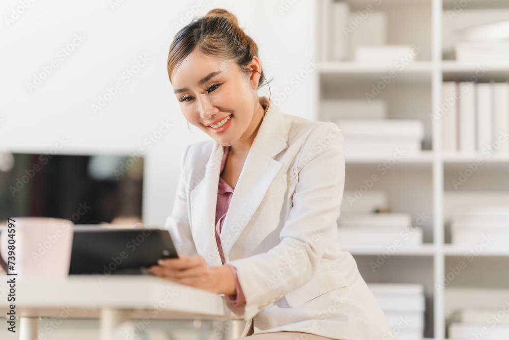 Businesswoman using computer to do daily tasks at modern office. Businesswoman using computer to do daily tasks at modern office.