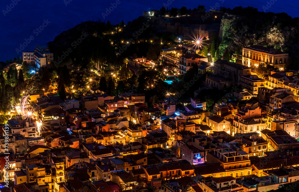 Beautiful view of night town of Italy with colorful golden lights, night landscape on city of Europe