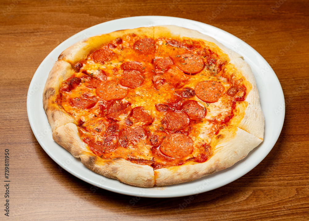Italian Pepperoni pizza on a plate.