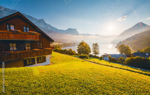 Fototapeta Naklejka Na Ścianę i Meble -  Impressive views of the morning garden in sunlight. Archkogl, Grundlsee, Austria.