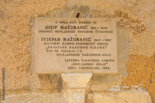Plaque outside birth house of Canon Josip Mazuranic, founder of Public Library and Reading Room, and Stjepan Mazuranic, teacher and collector of folk songs and anthems. Novi Vinodolski, Croatia photo