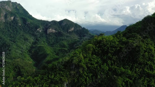 Karst peaks and mountains populated by green forests in Asia, Laos, towards Luang Prabang in summer on a sunny day.