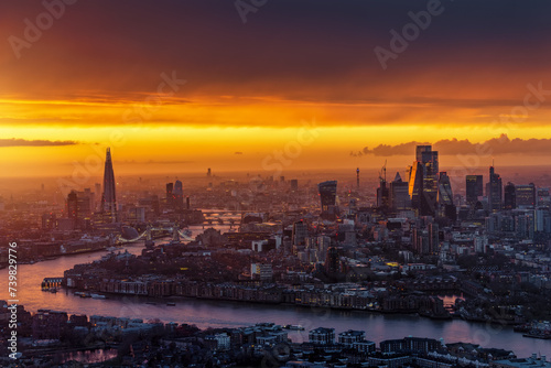 Panoramic view of a golden sunset behind the urban cityscape of London, England © moofushi