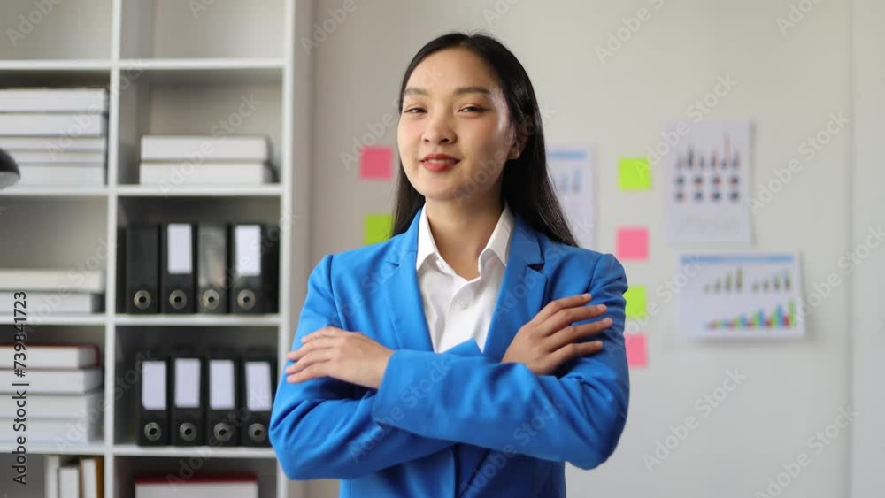 Attractive Asian businesswoman smiling happily. Attractive Asian businesswoman smiling happily.