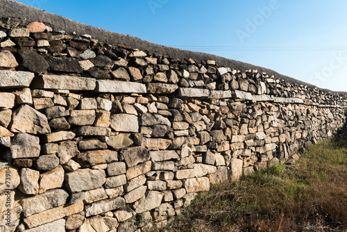 Ancient Stone Wall Under Clear Sky at Shravanabelagola in Broad Daylight