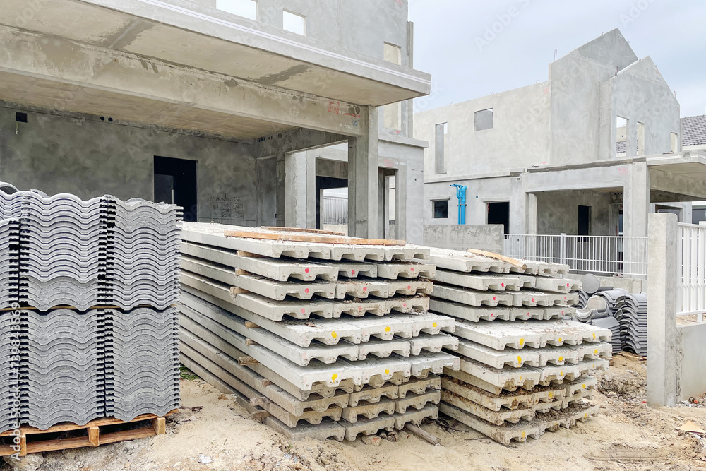 Construction site of property projects during construction show precast housing structure with roof and floor materials. Image use for real estate development presentation background. Construction site of property projects during construction show precast housing structure with roof and floor materials. Image use for real estate development presentation background.