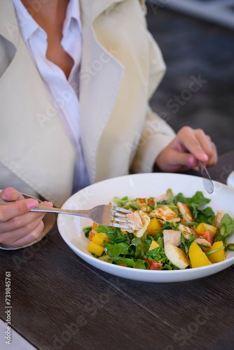 fruit and vegetable salad, girl eating salad