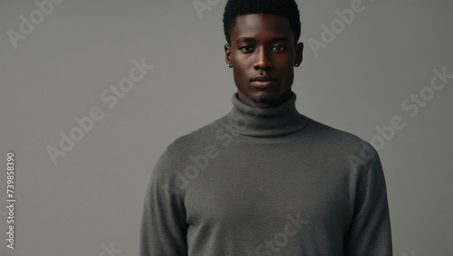 the skinny tall young african male model wearing a grey sweater
