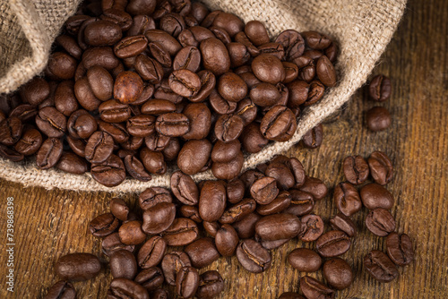 Coffee beans on grunge wooden background