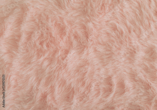 Pinkish orange or peachy pink faux fur background. Close up surface wool texture. Minimal background concept. Trendy color luxury layout. Fluffy fur flat lay. Retro fashion aesthetic idea. Copy space. photo