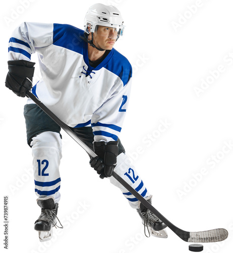 Concentrated young man, hockey player in uniform standing with stick on nice rink against transparent background. Concept of professional sport, competition, game, tournament, match, action photo