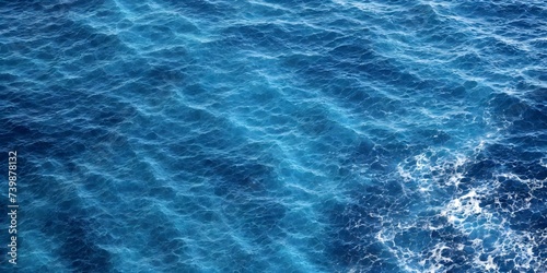 Blue sea water texture. Water splashing in the deep sea. © 360VP