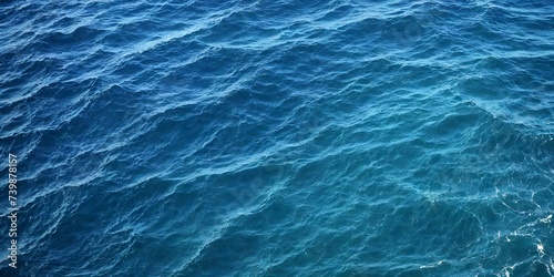 Blue sea water texture. Water splashing in the deep sea.