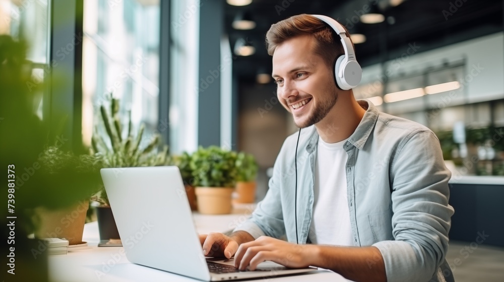 Fototapeta premium Happy student. Portrait of male student with laptop. Online study concept