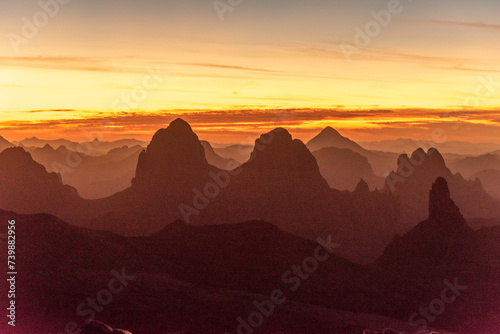 Hoggar landscape in the Sahara desert  Algeria. A view from Assekrem of the sunrise over the Atakor mountains