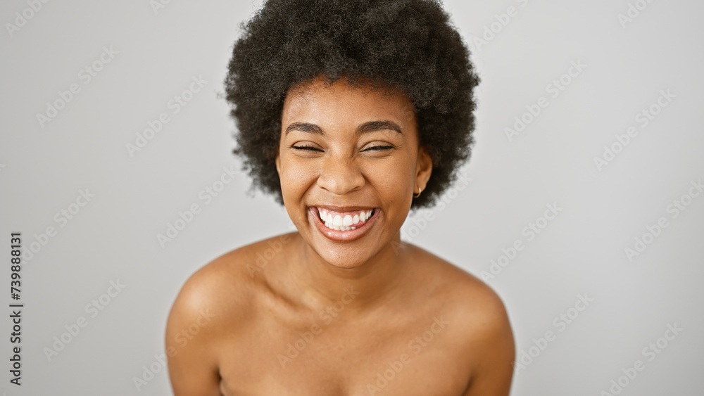 Portrait of a joyful african american woman with curly hair isolated on a white background. Portrait of a joyful african american woman with curly hair isolated on a white background.