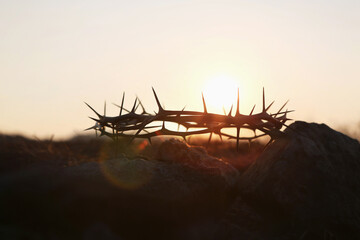 Calvary hill Golgotha cross of Jesus Christ crown of thorns symbolizing passion and suffering silhouette, lent easter background
