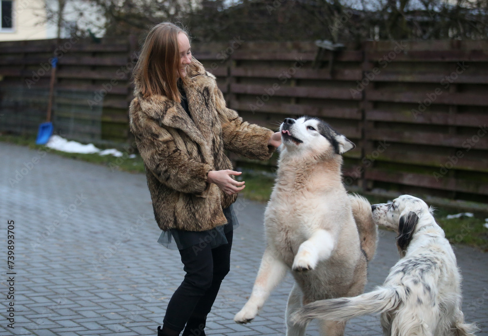 Happy girl with dogs outdoors Happy girl with dogs outdoors