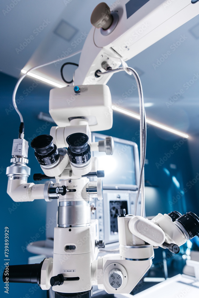 Surgical microscope in the operating room of a modern ophthalmology clinic with high-quality equipment. Vision correction, cataract treatment. Surgical microscope in the operating room of a modern ophthalmology clinic with high-quality equipment. Vision correction, cataract treatment.