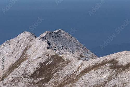 Mt. Bayuvi Dupki and Koncheto (Foal) shelter at stone ridge. Close view from Mt. Vihren summit.