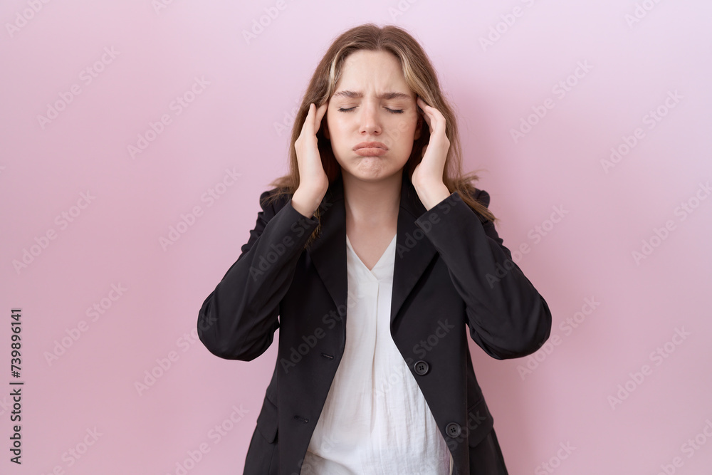 Young caucasian business woman wearing black jacket with hand on head, headache because stress. suffering migraine. Young caucasian business woman wearing black jacket with hand on head, headache because stress. suffering migraine.