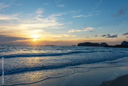 Summer background with tropical beach during sunset. Holiday vacation and travel concept.