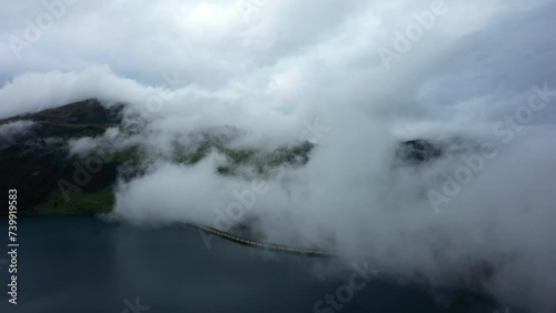 Wallpaper Mural Clouds over Lake Roselend in Europe, France, the Alps, Savoie, in winter, on a cloudy day. Torontodigital.ca