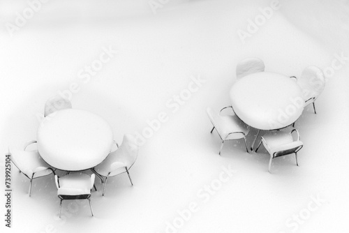 snowy tables and chairs  photo