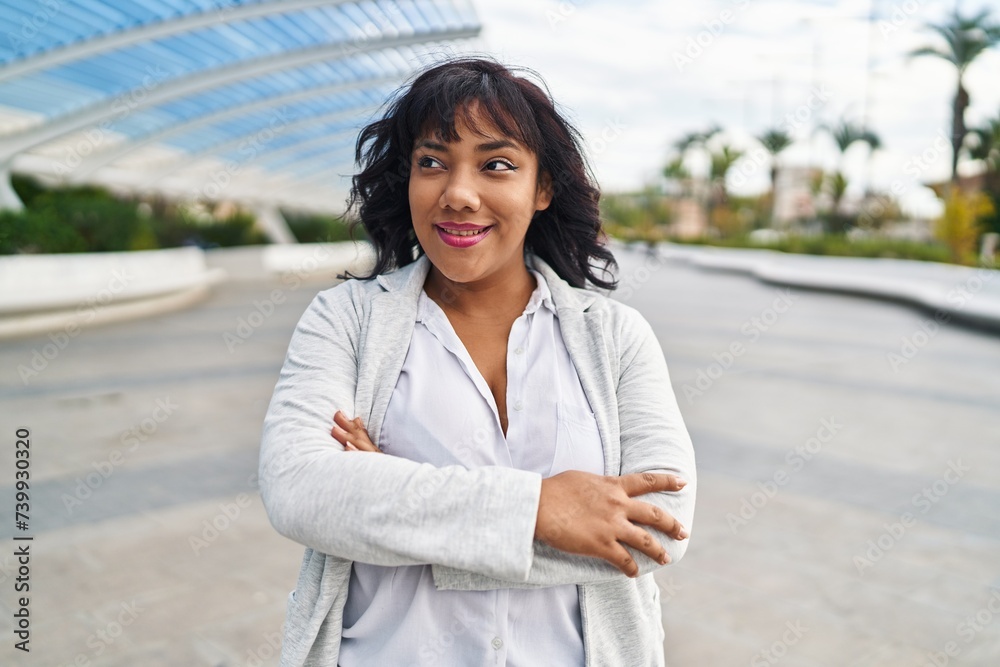 Young beautiful latin woman standing with arms crossed gesture at park Young beautiful latin woman standing with arms crossed gesture at park