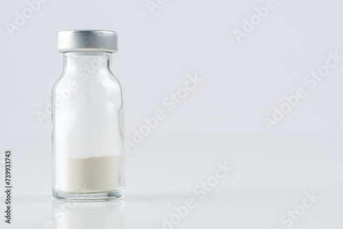 Vaccine vial glass on white background. Medicine vaccination concept. World pandemic concept.