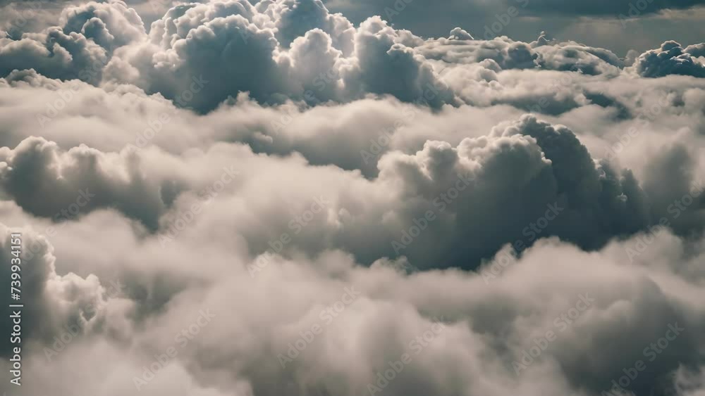 Aerial View of Clouds Through Airplane Window Aerial View of Clouds Through Airplane Window