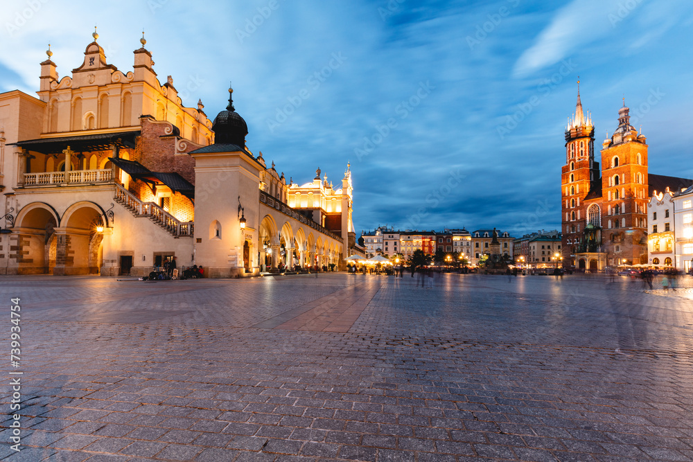 Cracow, Poland old town and St. Mary's Basilica seen from Cloth hall at night