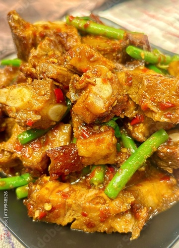 Thai food: Stir-fried crispy pork with curry paste