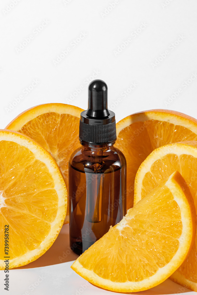 Serum in amber glass dropper bottle and cosmetics with vitamin C. Immunity protection concept, antiviral prevention Essential oil from citrus fruits. Serum in amber glass dropper bottle and cosmetics with vitamin C. Immunity protection concept, antiviral prevention Essential oil from citrus fruits.