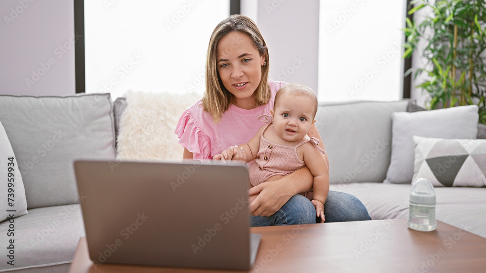 Mother and daughter's bond deepens, casually sitting on sofa at home, engaged in serious video call conversation