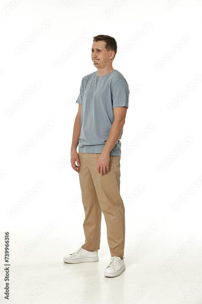 Naklejka premium offended frustrated young man on white background. sadness