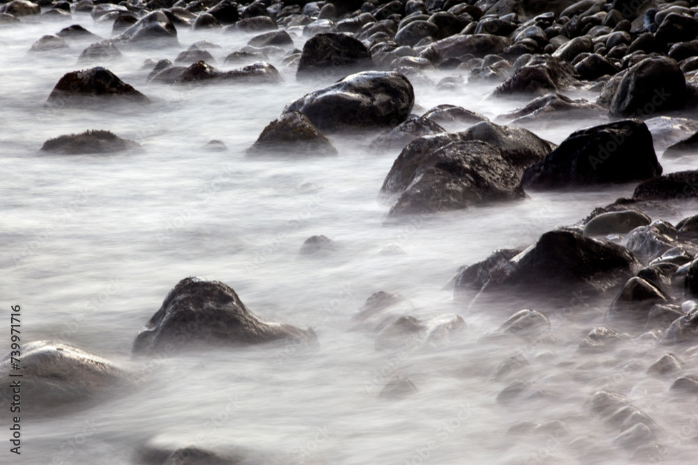 Long-exposure view of the surf at the pebble beach