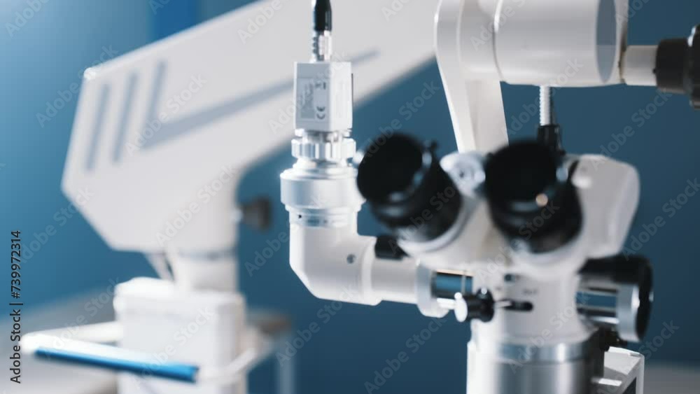 Surgical microscope in the operating room of a modern ophthalmology clinic with high-quality equipment. Vision correction, cataract treatment. Surgical microscope in the operating room of a modern ophthalmology clinic with high-quality equipment. Vision correction, cataract treatment.
