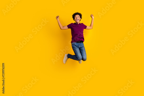 Full length photo of positive crazy guy wear stylish clothes celebrate success victory lottery jackpot isolated on yellow color background