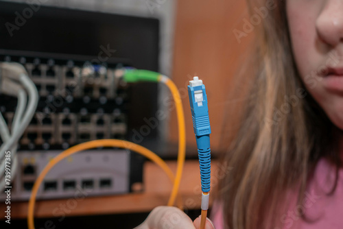 There is a close-up view of the fiber optic patch cord for Internet connection.