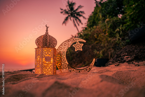 Lantern with crescent moon shape on the beach with sunset sky, 2024 Eid Mubarak greeting background, Ramadan Kareem photography, Ramadan greeting background photo