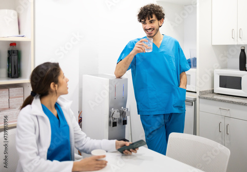 Healthcare colleagues taking a break in hospital staff room photo