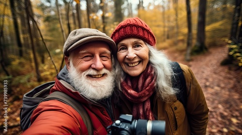 Happy Elderly Photographer Couple Taking Selfie in Forest