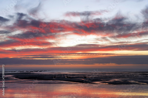 Low tide and sunset on Hauteville-sur-Mer beach.Cotentin coast