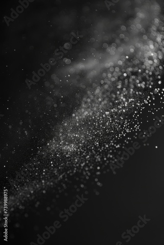 Abstract black background with brilliant dust