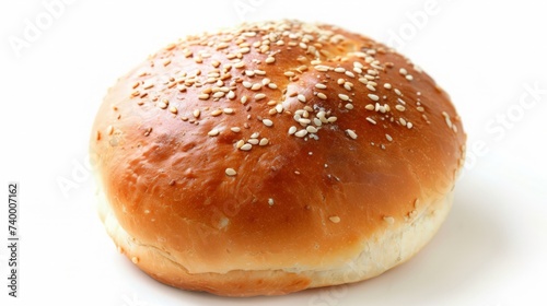 Top view shot of a hamburger bread bun, isolated on white background. The freshly baked, golden brown color and a sprinkling of sesame seeds on top.
