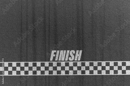 Finish line racing background top view,Textured asphalt with finishing line.