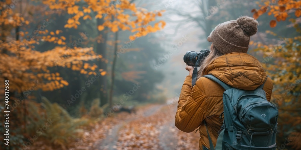 Female traveler capturing beauty of autumn forest young woman photography hiking embodying spirit of adventure and nature exploration showcasing happy tourist with camera and backpack