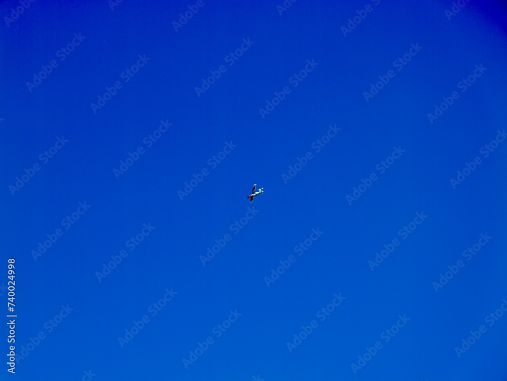 Plane flying near the Aeroclub de Castelló, El Grao de Castellón, Valencia, Spain Plane flying near the Aeroclub de Castelló, El Grao de Castellón, Valencia, Spain