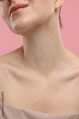 Beauty concept. Woman on pink background, closeup